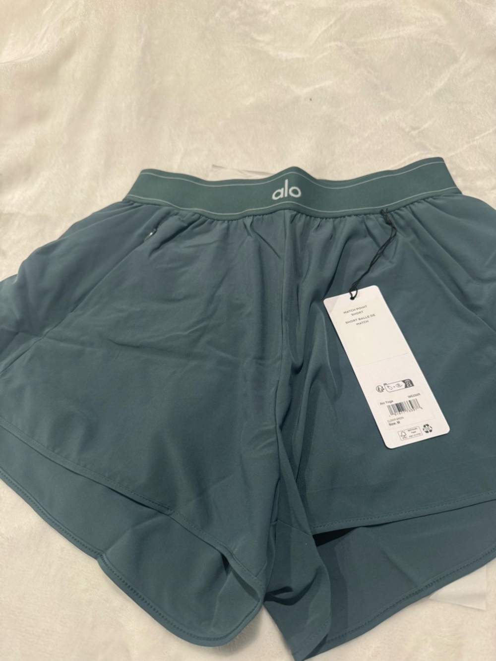 ALO Yoga Match Point Shorts in Clover Green